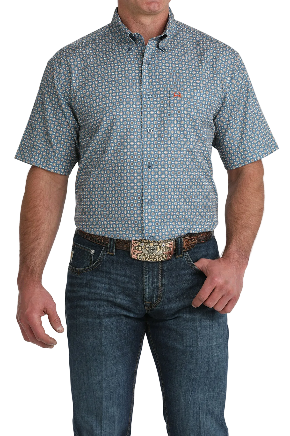 Man wearing a patterned short-sleeve shirt and jeans on a white background