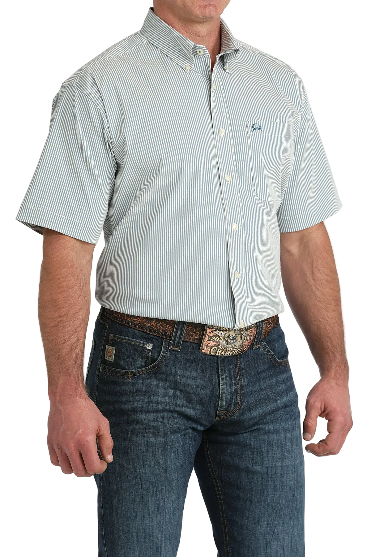 Man wearing a light blue short-sleeve button-up shirt with a subtle pattern and dark jeans on a white background.