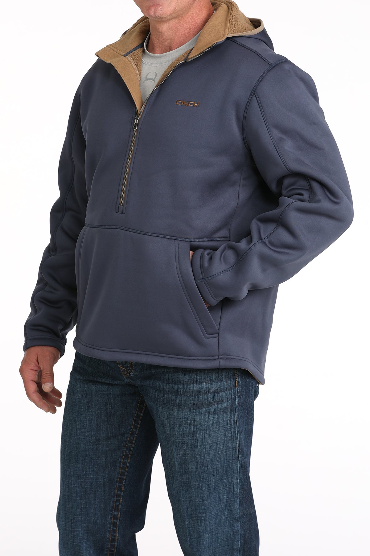 Man wearing a blue sherpa hoodie and jeans 