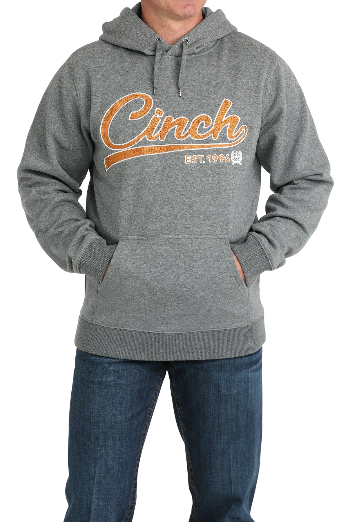 Man wearing a gray hoodie with a 'Cinch' logo written in orange lettering across the front, paired with jeans on a transparent background