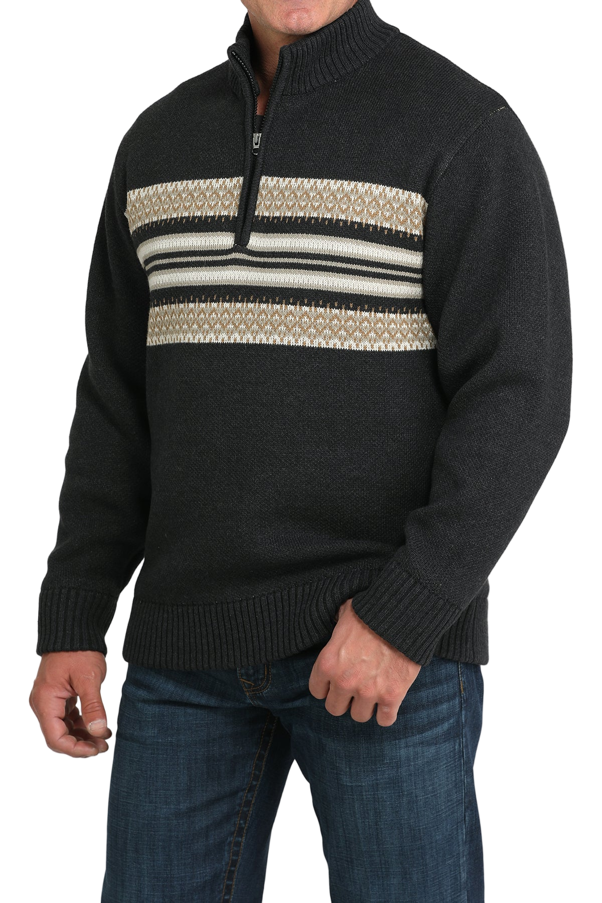 Black sweater with patterned chest area worn by a person on a white background