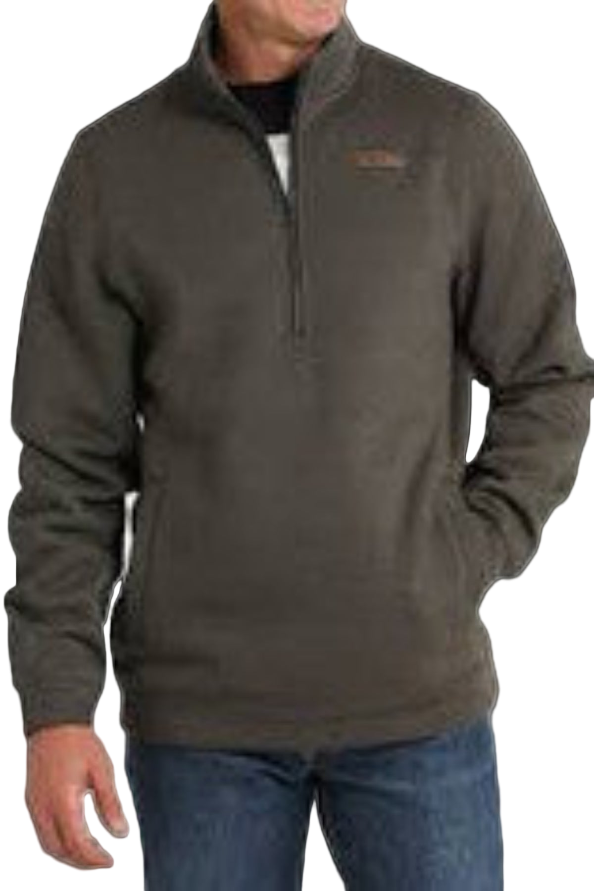 Man wearing a brown pullover with a logo on a plain background