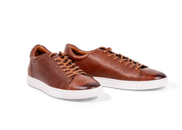 Pair of Go West Supply brown leather sneakers on a white background