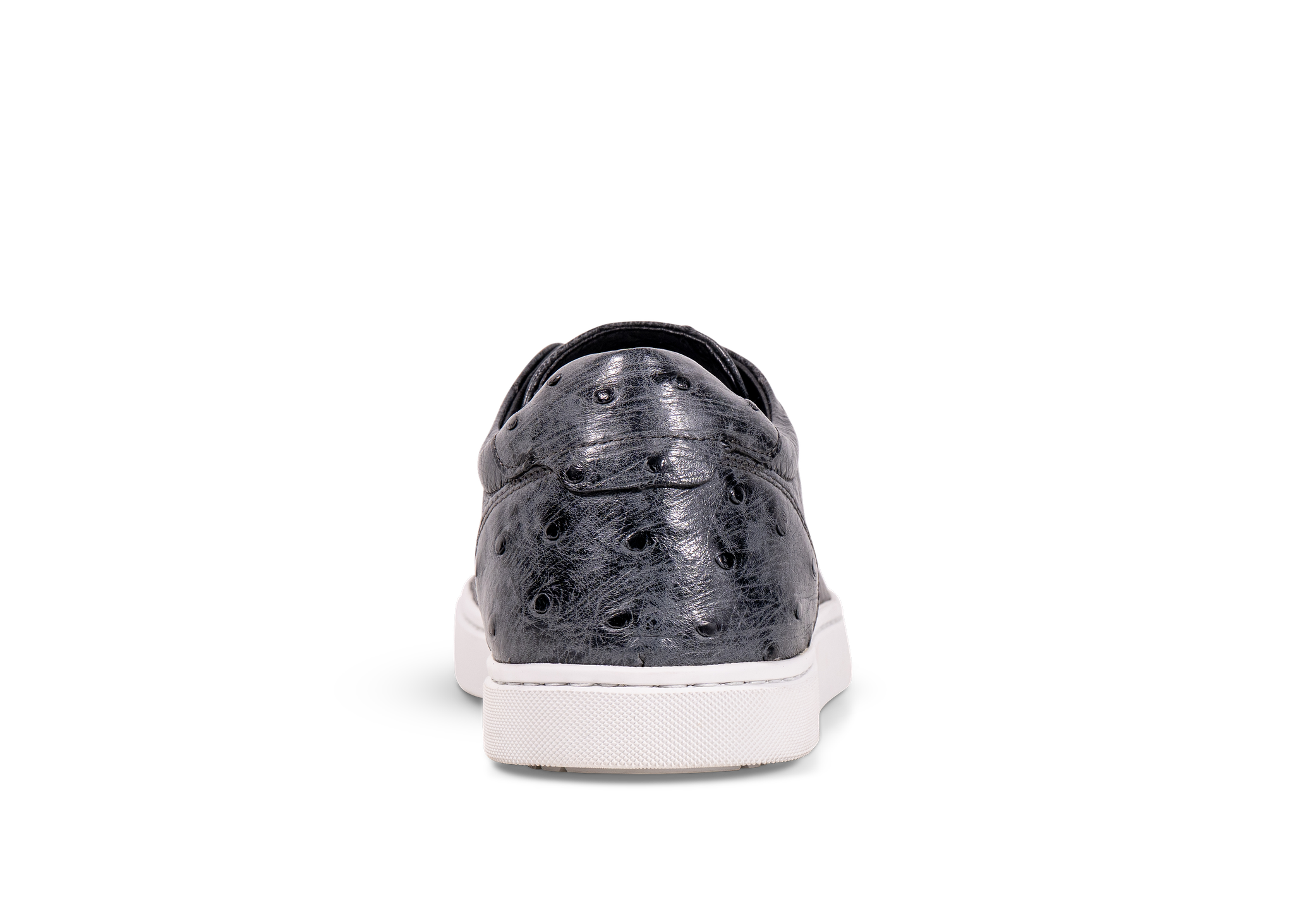 Pair of Go West Supply navy ostrich leather sneakers with a white sole on a white background