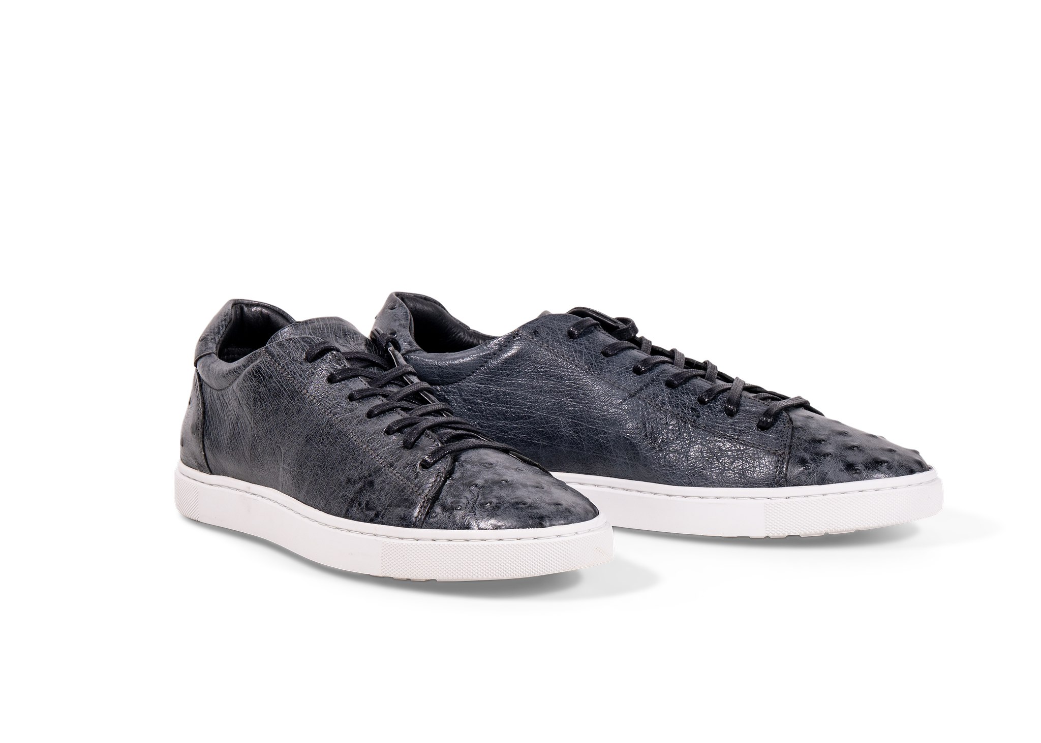 Pair of Go West Supply navy ostrich leather sneakers on a white background