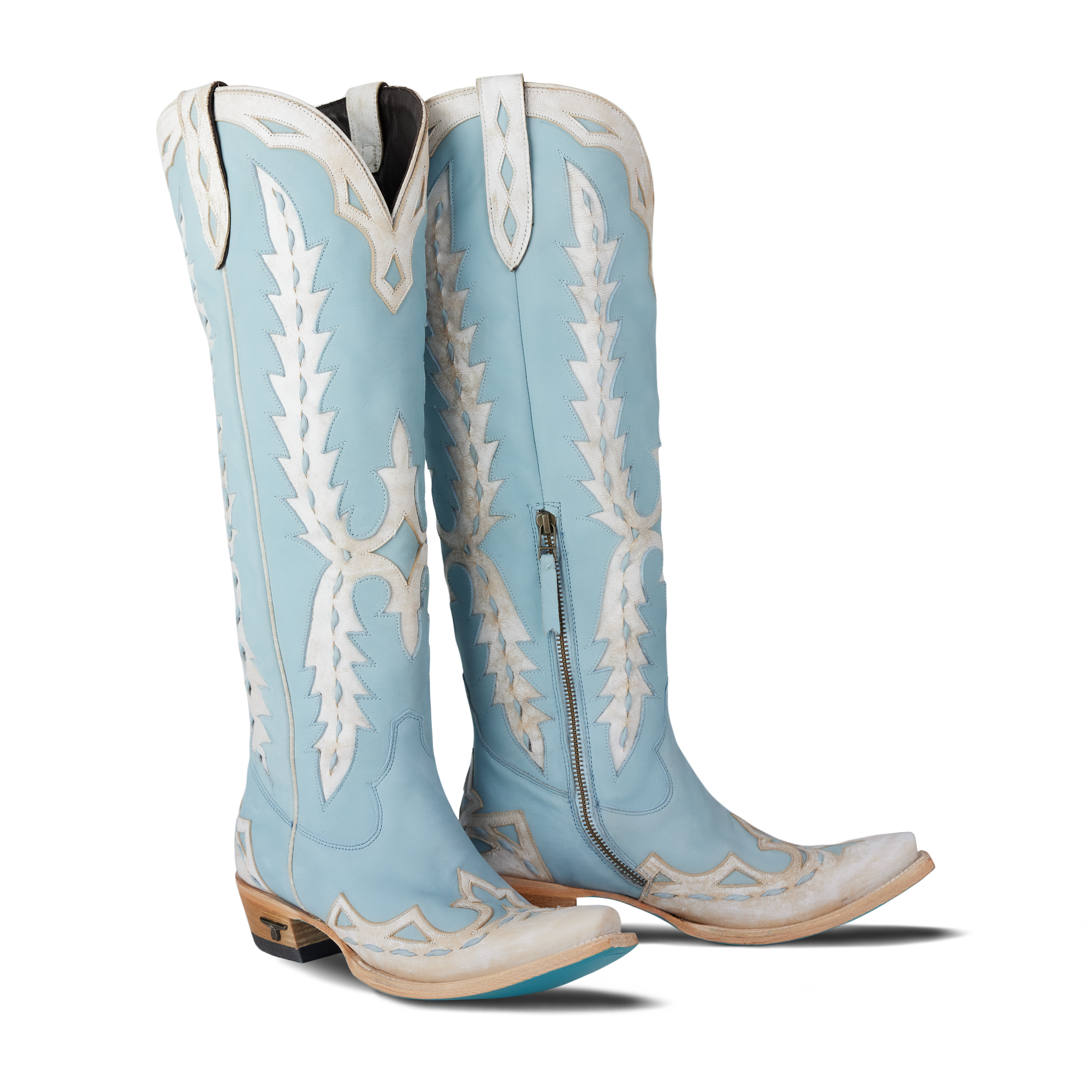 Pair of women’s powder blue knee-high western boots with white stitching and cutout detailing, displayed on a white background