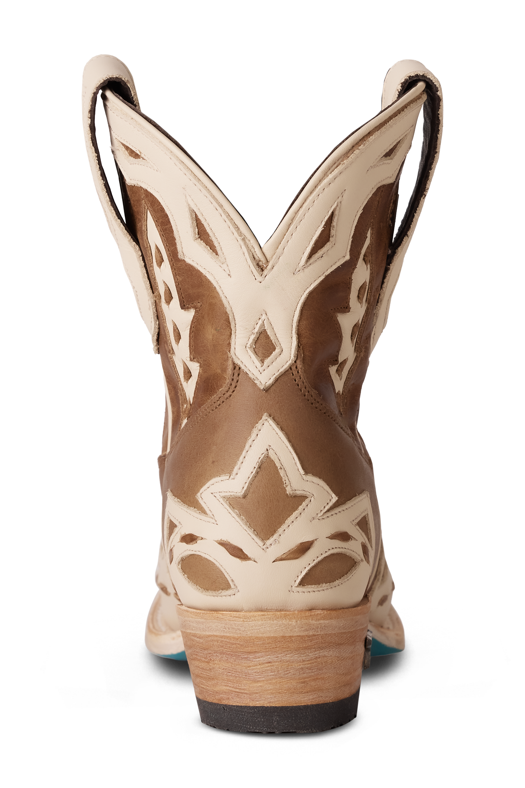 Back view of a brown and cream western ankle boot featuring detailed stitching, a short shaft with pull tabs, and contrasting cream overlays 