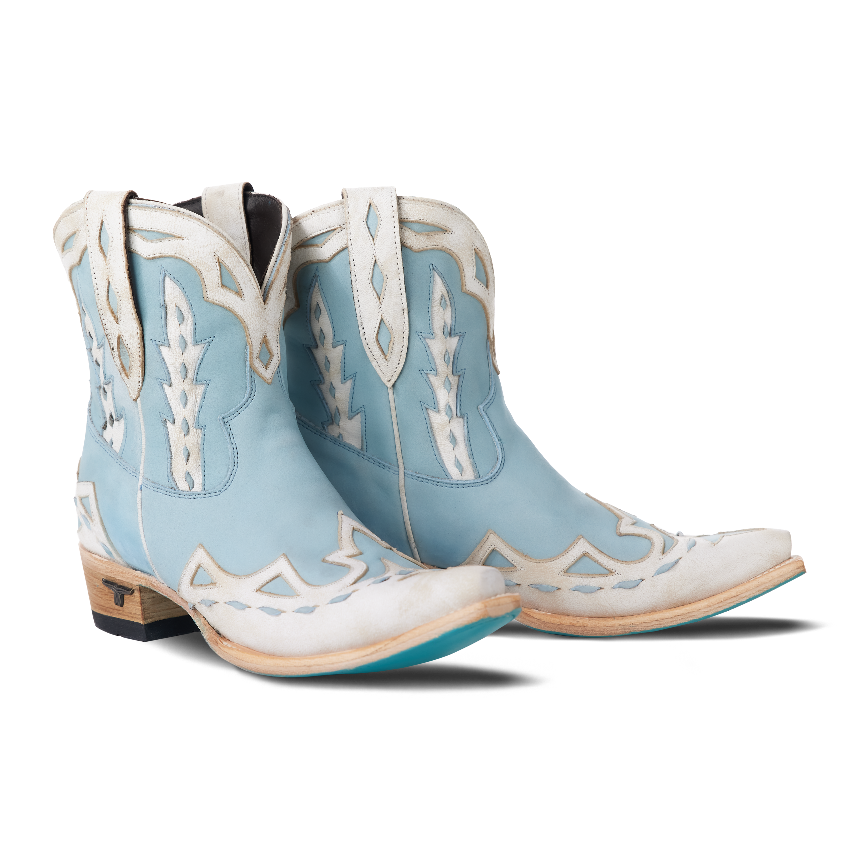 Pair of powder blue Go West Chase the Wind booties with white overlay design on a white background