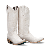 Pair of tall white boots with detailing and turquoise soles on a transparent background