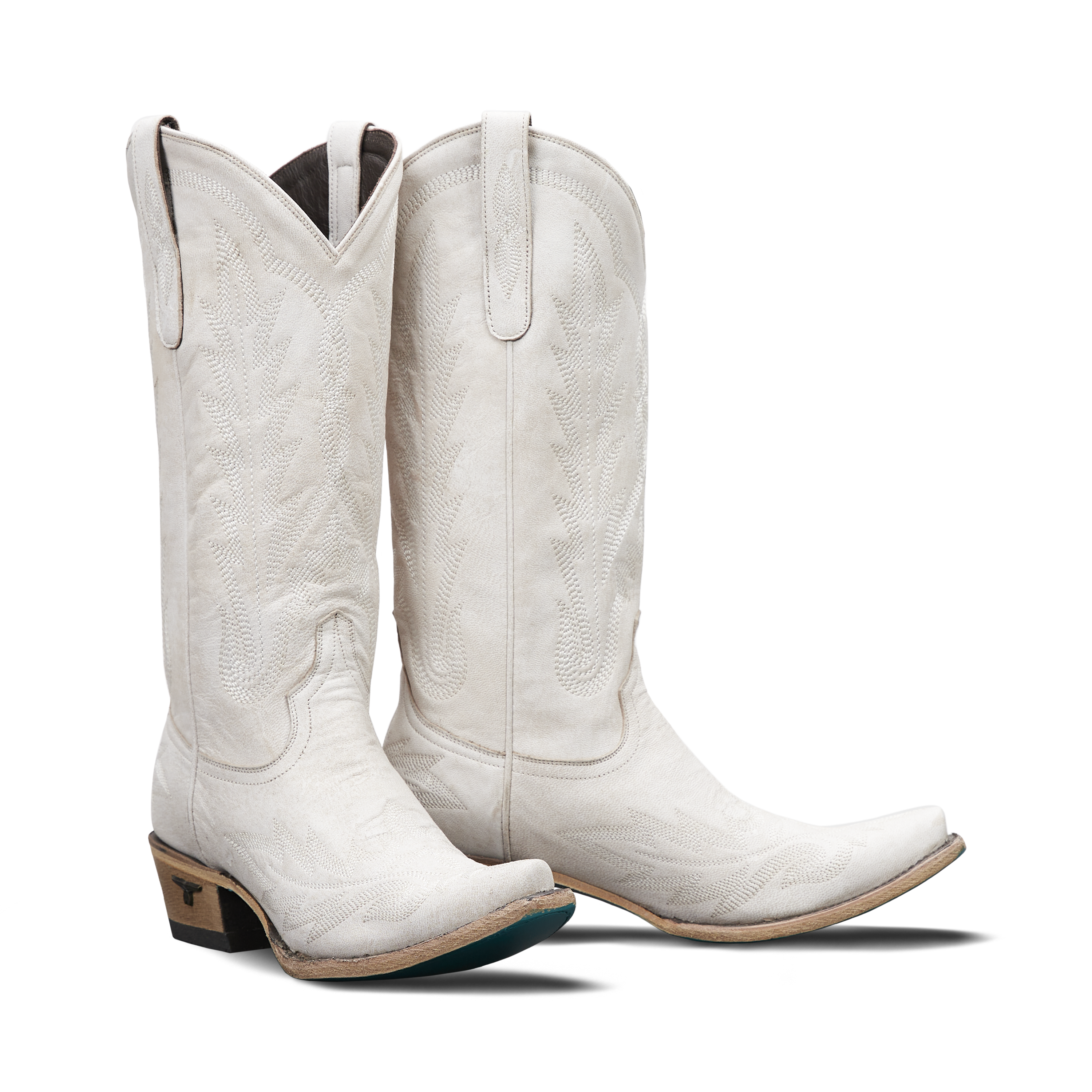 Pair of tall white boots with detailing and turquoise soles on a transparent background