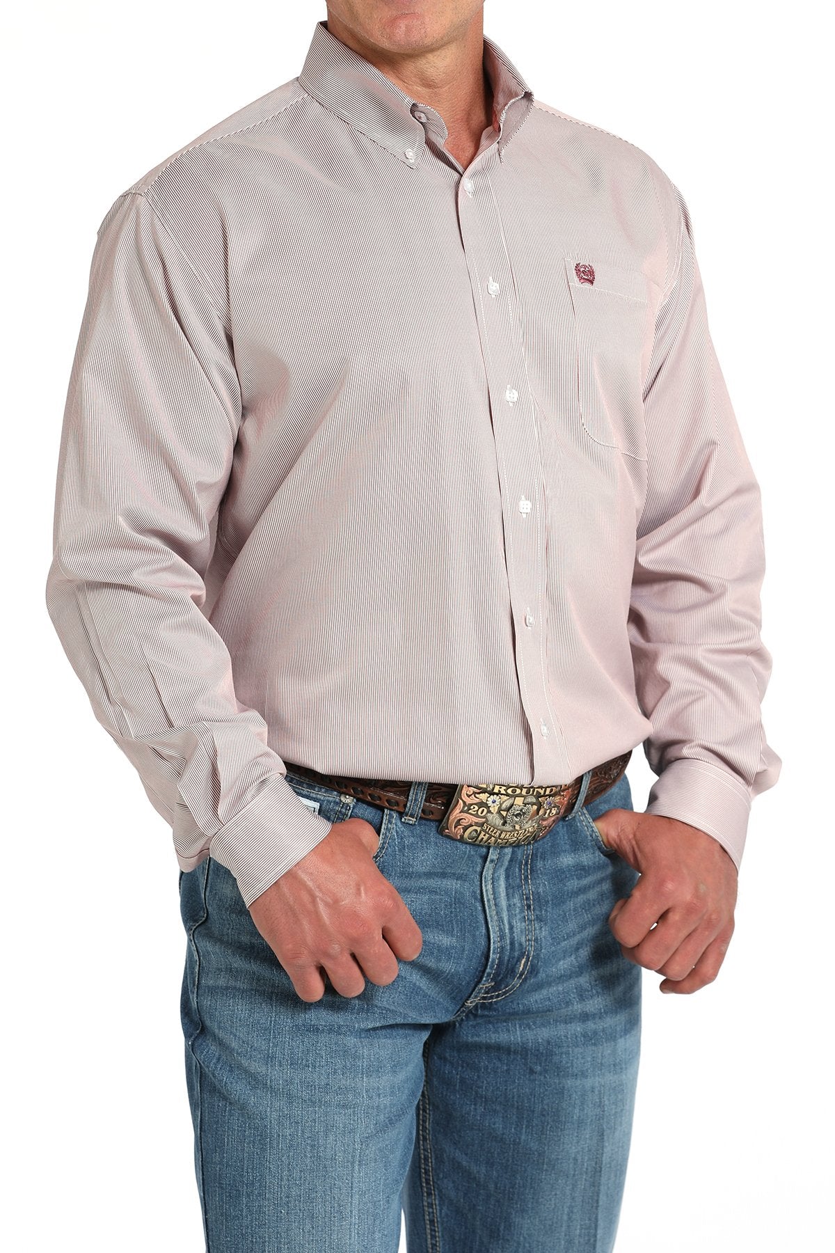 Side angled view of a man wearing a pink striped long-sleeve button-down shirt, paired with blue jeans and a western belt buckle displayed on a white background